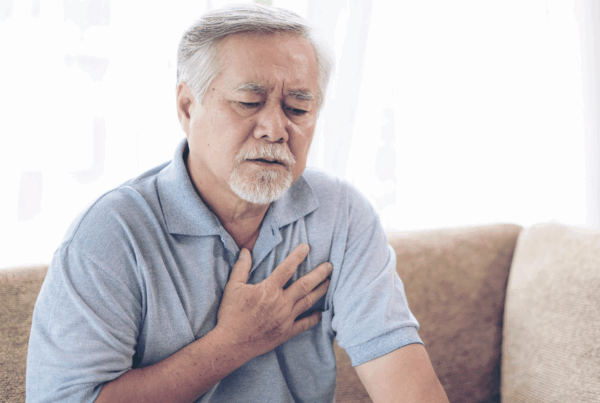 Senior man experiencing chest pain.