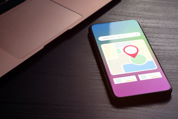 A smartphone map displays a red location pin after a search for “concierge doctor near me.”