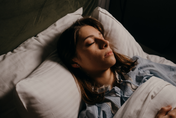 A woman sleeps soundly in her bed, during one of her REM cycles.