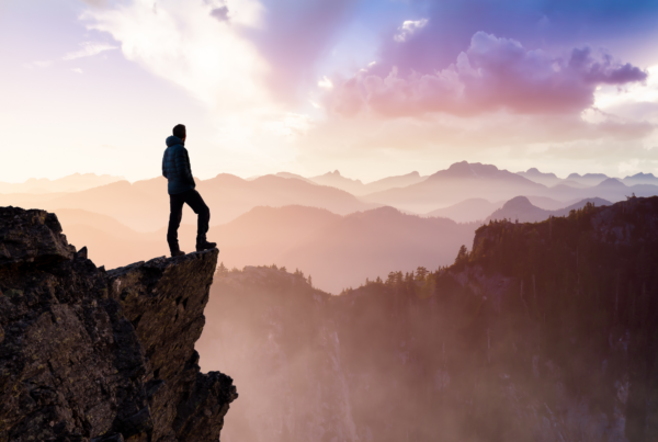 A person finding fulfillment after climbing the second mountain.