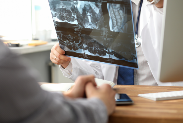 Person with a doctor navigating a cancer screening.