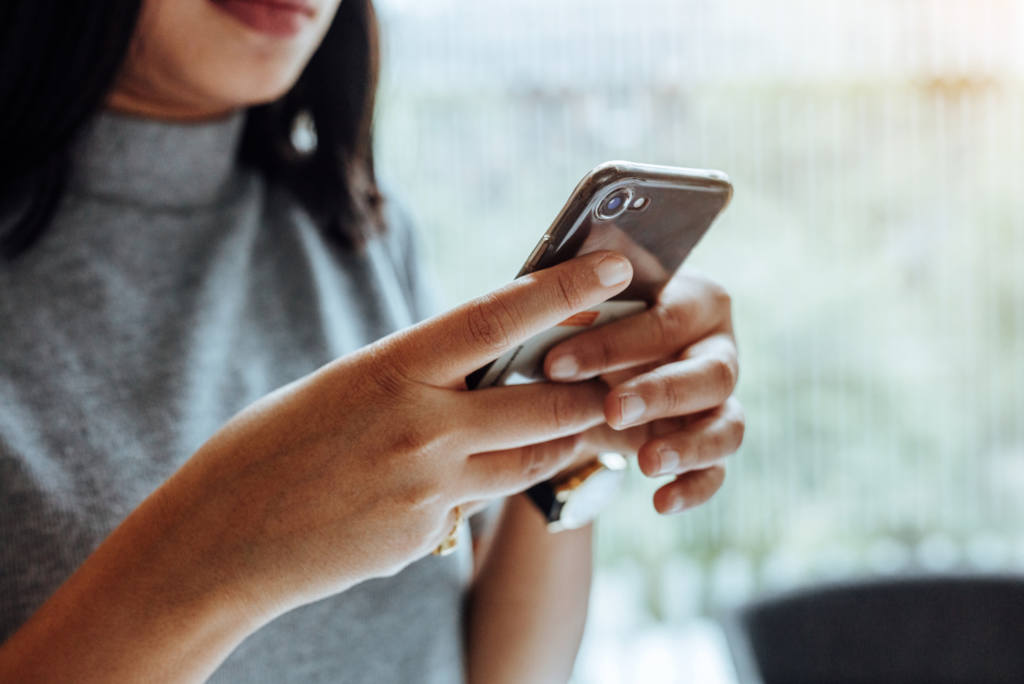 Woman holding phone.